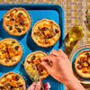 Cabot pairing guide, cheddar tarts on blue baking sheet